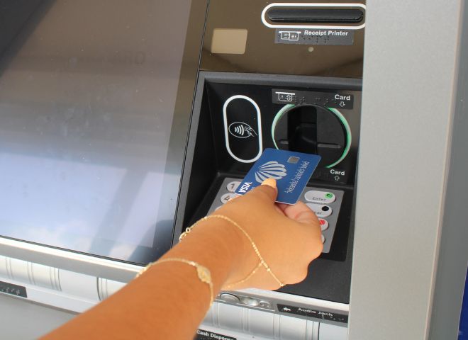 Woman using ATM