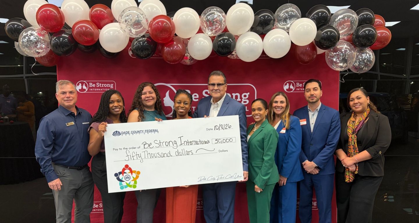 group holding donation check