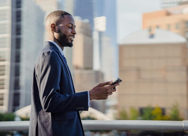 Business man looking at smartphone
