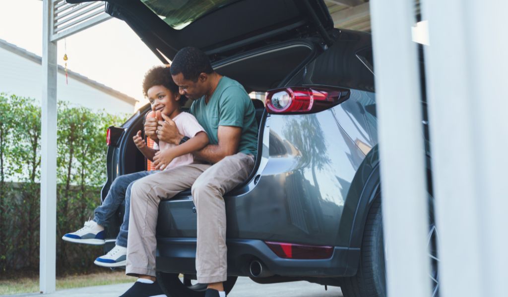 dad and son in car