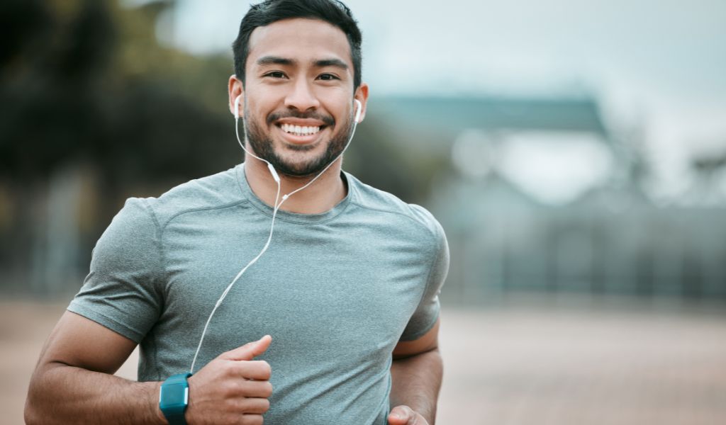 man running with headphones
