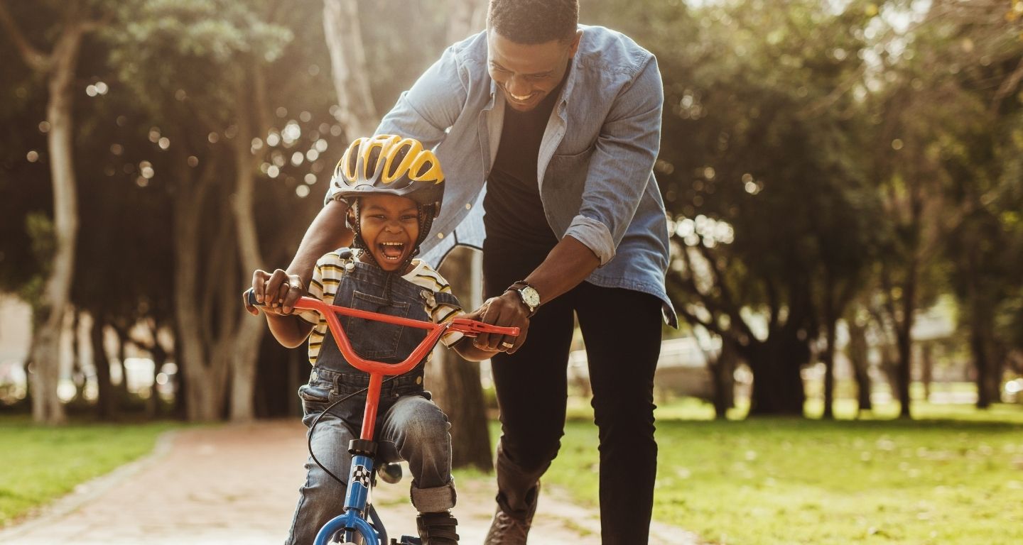 dad and son riding bike