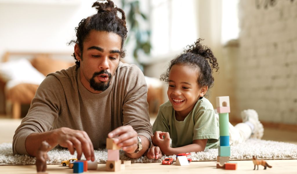 Dad and daughter playing blocks