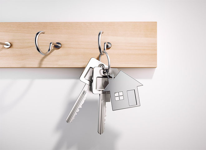 Silver house keys on a hook