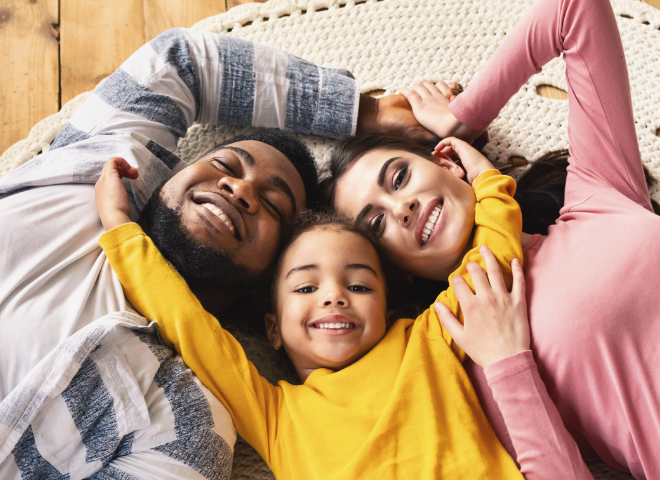 family laying on floor