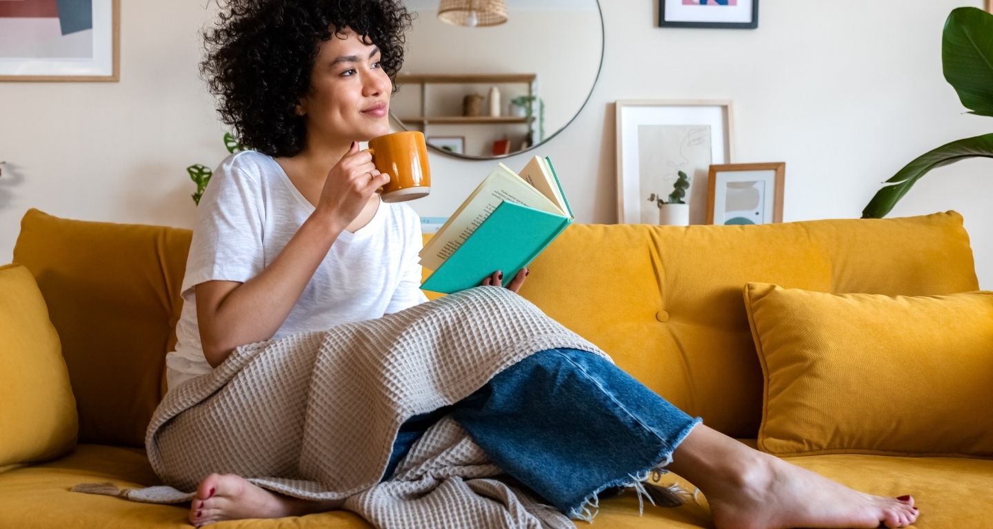 Woman on couch in home