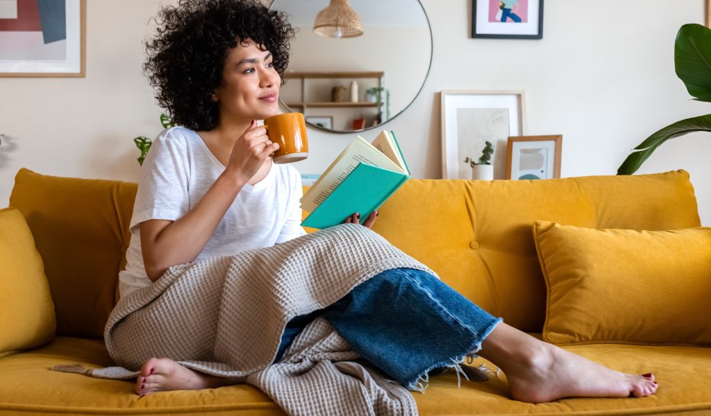 Woman enjoying coffee in her home