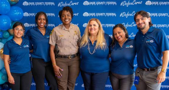 Five representatives of DCFCU with Miami-Dade County Police officer