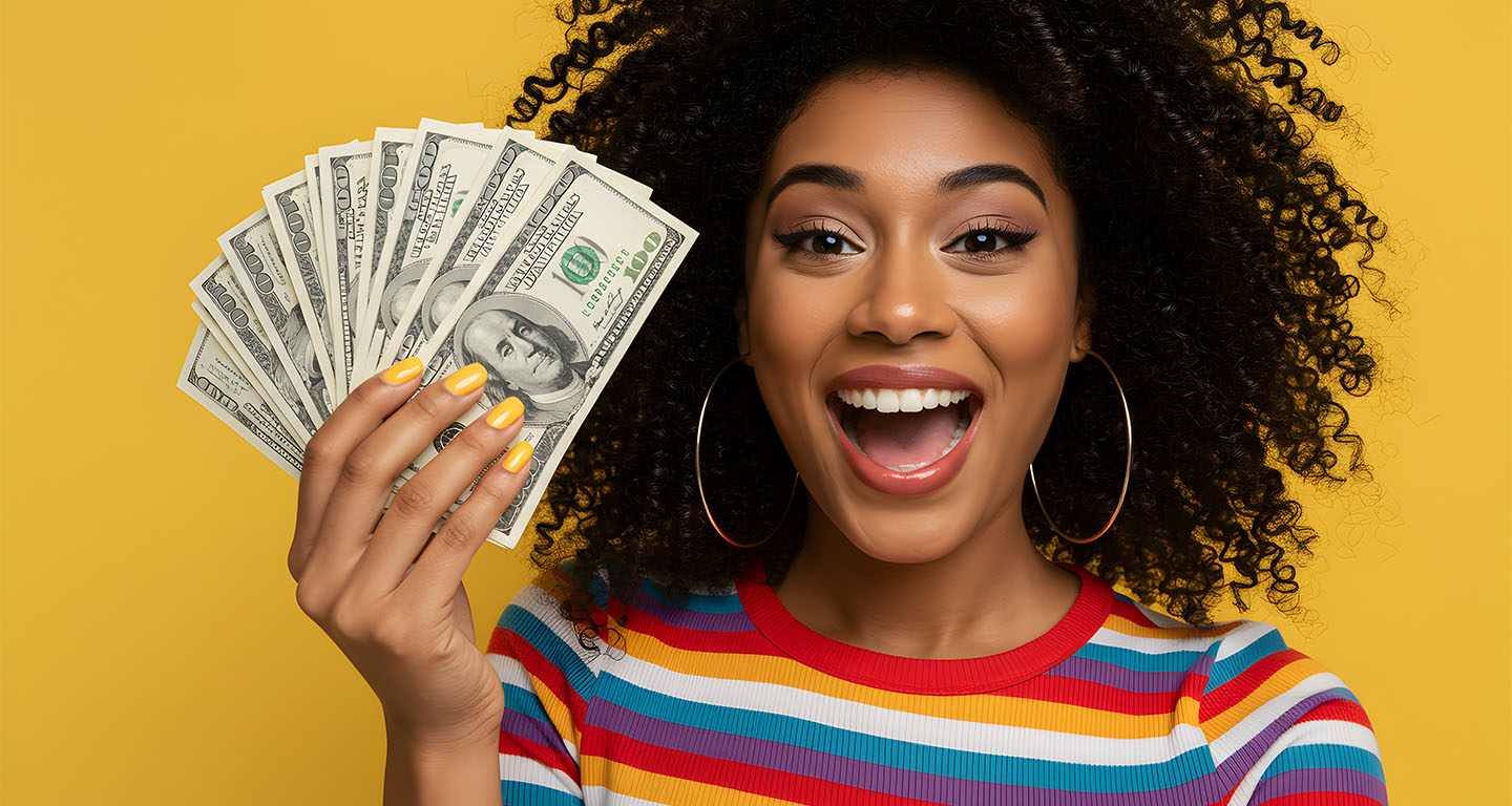 Young woman holding cash